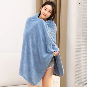 Soft coral fleece bath towel and cozy nap blanket for home and office use, solid blue.