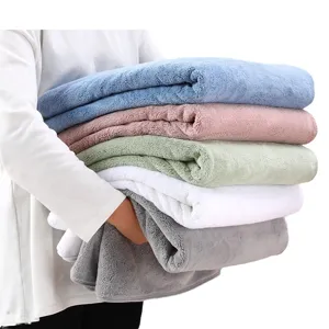 Soft coral fleece bath towel blanket stack, absorbent home shower and nap shawl use.