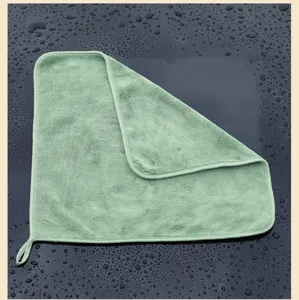 Detailed view of thick green coral fleece car cleaning towel with hanging loop.