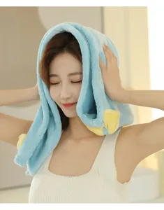 Close-up detail of soft blue and yellow nano-fleece dry hair cap worn by model, highly absorbent.