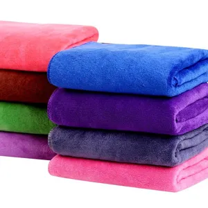 Colorful microfiber cleaning towels stacked neatly, super absorbent car wash wiping cloth.