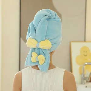 Soft blue microfiber hair drying cap with cute yellow bows, highly absorbent and comfortable.