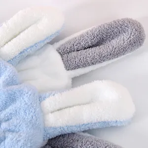 Cute rabbit ear hair drying towel detail, soft plush fabric, ultra absorbent blue and white.