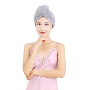 Coral fleece dry hair cap, thick absorbent bath towel wrap in grey, worn by model for hair care.