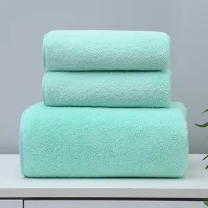 Soft coral fleece towel and bath towel set, absorbent and comfortable for daily use.