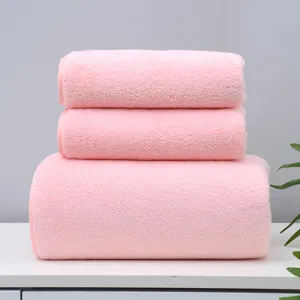 Soft pink coral fleece towel and bath towel set, highly absorbent for daily home bath use.