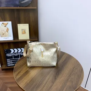 Gold quilted shoulder bag with pearl pendant, stylish crossbody bag for women daily casual