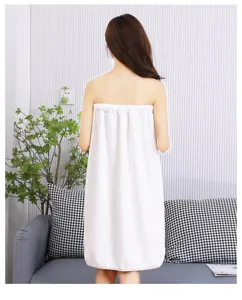 Detailed view of white coral fleece wearable bath towel, soft and cozy wrap skirt for daily use.