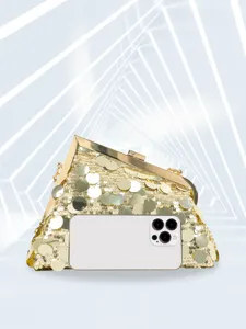 Detail view of a luxury gold sequin evening clutch bag with metal frame, party event prop.