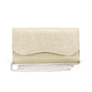 Close-up detail of gold glitter evening clutch with silver chain strap and wavy flap.