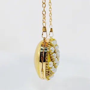 Stunning gold pearl rhinestone evening bag clutch, luxurious bridal crossbody handbag.