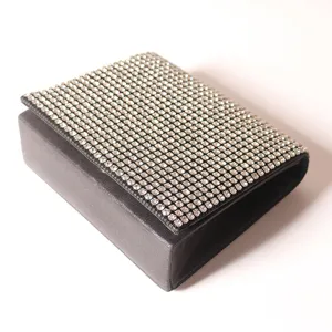 Elegant black rhinestone evening clutch bag for women, sparkling crystal flap purse for parties.