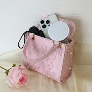 Pink embroidered handbag with pearl accents, elegant Chinese style design for women evening party.