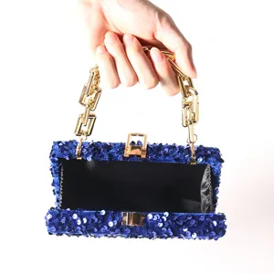 Stunning blue sequin evening clutch bag with luxury gold chain handle and secure metal lock closure.