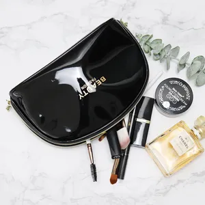 Black patent leather cosmetic bag, portable waterproof travel makeup storage pouch for women.