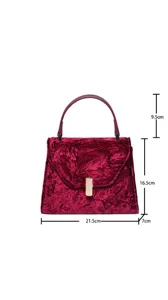 Red velvet top handle handbag detail showing precise dimensions and elegant crush texture