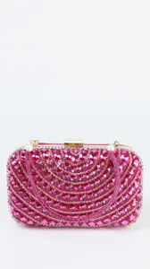 Stunning pink rhinestone evening clutch bag detail showing sparkling crystals and gold hardware.