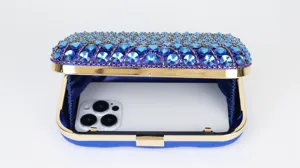Blue crystal evening clutch bag with gold frame and phone capacity detail shot for women.