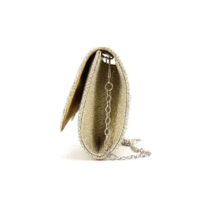 Gold glitter evening clutch bag detail side view stylish women handbag cross-body accessory.