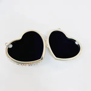 Heart-shaped rhinestone evening bag detail view, luxury bridal clutch purse with inner lining.