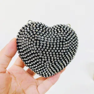 Details of the sparkling rhinestone heart evening bag, elegant sparkly clutch purse close-up.