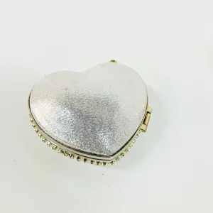 Heart shaped evening bag with sparkling silver glitter finish and rhinestone crystal trimmed edges for women.