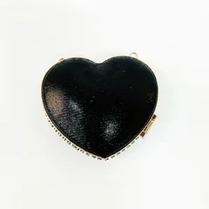 Black heart-shaped evening bag with shimmering rhinestones and gold metallic frame detail.