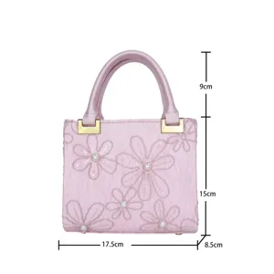 Pink floral embroidered handbag with top handle, pearl decor and gold hardware, size 17.5x15cm.