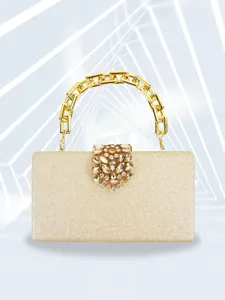 Gold glitter evening clutch detail with crystal clasp and chain handle, party fashion bag accessory