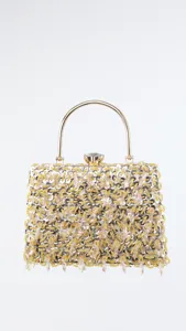 Elegant women evening clutch bag with beaded sequins, gold handle and crystal clasp detail.