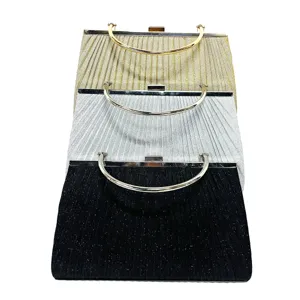 Detailed view of the pleated evening clutch bag with metallic handle and secure lock.