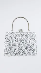 Sparkling crystal evening bag detail, silver sequin clutch purse with metal handle for party.