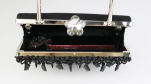 Black velvet evening clutch bag featuring crystal flower clasp and exquisite beaded fringe.
