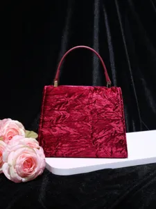 Elegant dark red velvet top handle handbag for women, stylish niche design fashion bag.