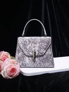 Elegant velvet top handle shoulder bag for women, stylish square design with metallic clasp.