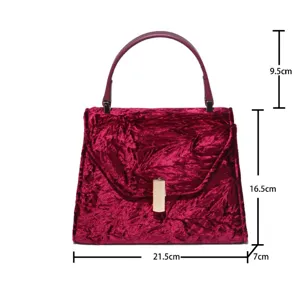 Elegant red velvet top handle handbag with gold clasp, stylish shoulder bag for women.