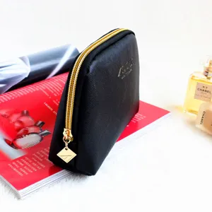 Black saffiano leather cosmetic pouch with gold zipper for women's daily travel storage.