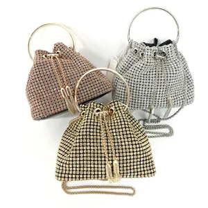 Rhinestone evening bag set featuring metal ring handles and sparkling crystal details for party.