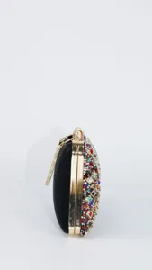 Elegant women's evening clutch bag with colorful rhinestones, black velvet and gold frame.