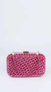 Detailed view of a stunning pink crystal evening clutch bag with sparkling rhinestones.