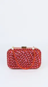 Red crystal evening clutch bag featuring sparkling rhinestones and elegant gold tone hardware details.