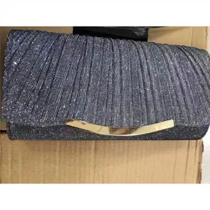 Glitter pleated evening clutch bag with elegant curved gold metal clasp for party.