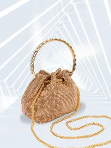 Detailed view of rhinestone evening bag with sparkling crystals and metal ring handle.