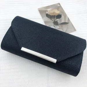 Black glitter evening clutch bag detail, elegant silver metal bar, wedding party prop