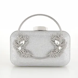 Silver glitter clutch bag for women, elegant evening handbag with crystal feather decor.