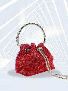 Red rhinestone evening bag detail view, sparkling crystal bucket purse with metal ring handle.