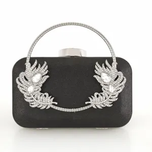 Black evening clutch bag with silver round handle and sparkling crystal peacock feather design.