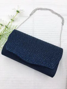 Navy blue pleated evening clutch bag detail, glitter surface with silver chain strap.