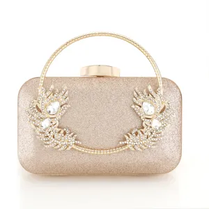Elegant rhinestone evening clutch bag with gold round handle and sparkly feather details.