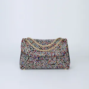 Exquisite rhinestone shoulder bag detail, sparkling crystal evening bag close-up view.